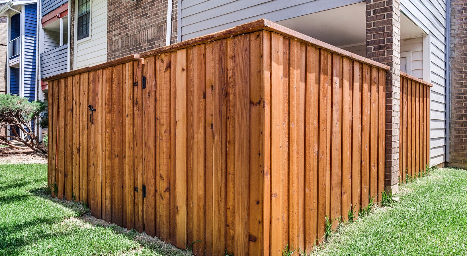 a wooden fence in front of a house at The Hudson